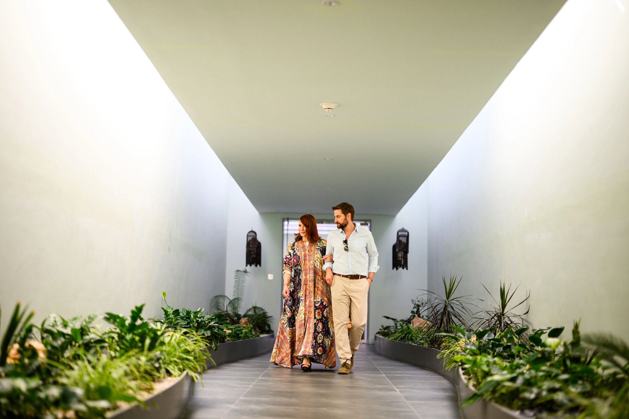 Couple walking through a luxury resort setting